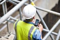 Workers inspecting construction works on a scaffold Royalty Free Stock Photo