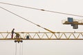 Workers inspecting and servicing a big construction crane in Belgrade