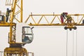 Workers inspecting and servicing a big construction crane in Belgrade