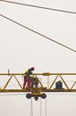 Workers inspecting and servicing a big construction crane in Belgrade