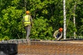 Workers install steel reinforcement for concrete structure