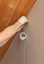 Workers install tape on drywall for plastering. Home renovation. Royalty Free Stock Photo