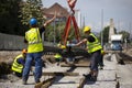 Workers install tram rails