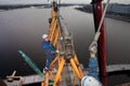 Workers installers fixed working construction boom hoisting tower crane