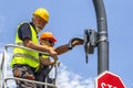 Workers installing city cctv security camera Royalty Free Stock Photo