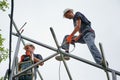 Workers installing metal beams for solar panels Royalty Free Stock Photo