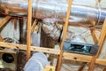Work in progress on duct installation in residential building attic space Royalty Free Stock Photo