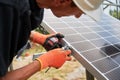 Workers installing solar panel on metal beams Royalty Free Stock Photo