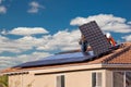 Workers Installing Solar Panels on House Roof Royalty Free Stock Photo