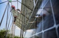 Workers installing solar panels on metal beams Royalty Free Stock Photo