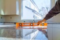 Workers installing top counter kitchen interior cabinet Royalty Free Stock Photo