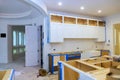 Modern kitchen renovation in progress with cabinetry installation and open layout design Royalty Free Stock Photo