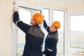 Workers installing window Royalty Free Stock Photo