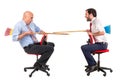 Workers jousting in office chairs Royalty Free Stock Photo