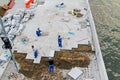 Workers laying paving road tiles on the waterfront in Moscow