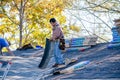 Workers laying shingles on a roof Royalty Free Stock Photo