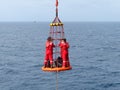 Transfer crews by personal basket from the platform to crews boat.