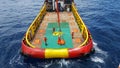 Workers are lifted by the crane to the offshore platform, Transfer crews by personal basket from crews boat to the platform. Royalty Free Stock Photo