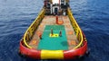 Workers are lifted by the crane to the offshore platform, Transfer crews by personal basket from crews boat to the platform. Royalty Free Stock Photo