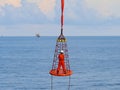 Workers are lifted by the crane to the offshore platform, Transfer crews by personal basket from the platform to crews boat. Royalty Free Stock Photo