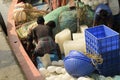 Workers loading fishing nets, crates, ice blocks for preparation of voyage at Frezarganj Harbor, West Bengal, India