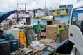 Workers loading goods in supply boat