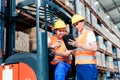 Workers in logistics warehouse Royalty Free Stock Photo