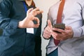 Workers look at the phone and show ok Royalty Free Stock Photo