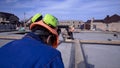 Workers make measurements measuring tape on construction. Clip. Builders in uniform and hard hat working on construction Royalty Free Stock Photo