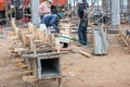 Workers makes column box and keep by crane for built column
