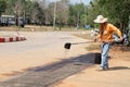 Workers making asphalt at road