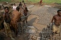 Workers making bricks in Rwanda.