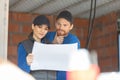 workers man and woman discuss construction plan Royalty Free Stock Photo