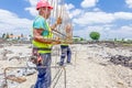 Workers are manually carrying rebar skeleton made for reinforce