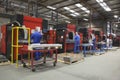 Workers At Manufacture Workshop Operating Machines