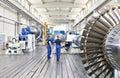 Workers manufacturing steam turbines in an industrial factory Royalty Free Stock Photo