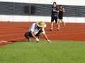 Workers measure the football field on the lawn with a roller rope Royalty Free Stock Photo