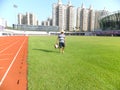 Workers measure the football field on the lawn with a roller rope Royalty Free Stock Photo