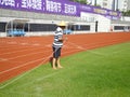 Workers measure the football field on the lawn with a roller rope Royalty Free Stock Photo