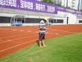 Workers measure the football field on the lawn with a roller rope Royalty Free Stock Photo