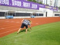 Workers measure the football field on the lawn with a roller rope Royalty Free Stock Photo