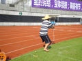 Workers measure the football field on the lawn with a roller rope Royalty Free Stock Photo