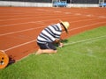 Workers measure the football field on the lawn with a roller rope Royalty Free Stock Photo