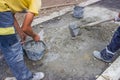 Workers Mixing concrete by hand Royalty Free Stock Photo