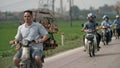 Workers on motorbikes, Hanoi, Vietnam