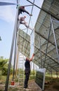 Workers mounting photovoltaic solar panel system Royalty Free Stock Photo