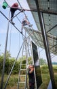 Workers mounting photovoltaic solar panel system Royalty Free Stock Photo