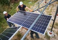 Workers mounting photovoltaic solar panel system Royalty Free Stock Photo