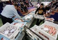 Workers moving cargo on fish market