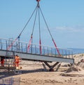 Workers near the final segment of new bridge in Lossiemouth, being put in place